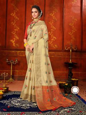 Celebrate This Festive Season With Beauty And Comfort Wearing This Pretty Silk Based Saree In Beige Color Paired With Contrasting Red Colored Blouse. This Saree And Blouse Are Fabricated On Art Silk Beautified With Weave.
