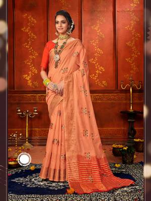 Adorn A Rich Look Wearing This Designer Saree In Peach Color Paired With Contrasting Orange Colored Blouse. This Saree and Blouse Are Fabricated On Art Silk Beautified With Attractive Weave. Buy Now.