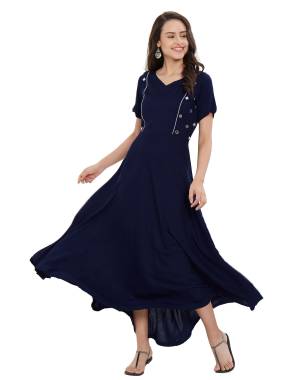 Grab This Beautiful Designer Long Kurti In Navy Blue Color. This Readymade Kurti Is Fabricated On Rayon Beautified With Mirror Work. It Is Light Weight And Soft Towards Skin.