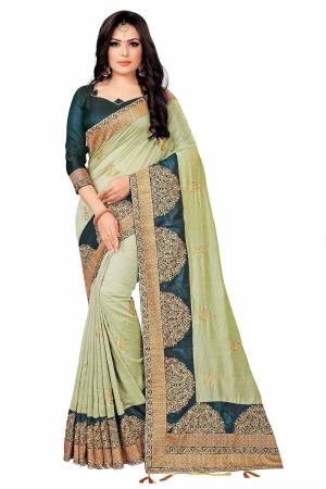 You Will Definitely Earn Lots Of Compliments Wearing This Rich And Elegant Looking Designer Saree In Light Green Color Paired With Teal Green Colored Blouse. This Saree Fabricated On Vichitra Silk Paired With Tafeta Art Silk Blouse. Buy This Pretty Saree Now.