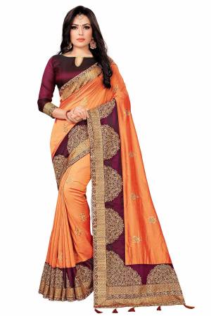 You Will Definitely Earn Lots Of Compliments Wearing This Rich And Elegant Looking Designer Saree In Dark Peach Color Paired With Wine Colored Blouse. This Saree Fabricated On Vichitra Silk Paired With Tafeta Art Silk Blouse. Buy This Pretty Saree Now.