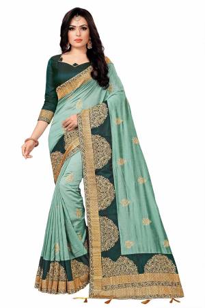Look Attractive In This Pretty Embroidered Designer Saree In Turquoise Blue Color Paired With Teal Blue colored Blouse. This Saree Is Silk Based Paired With Tafeta Art Silk Fabricated Blouse. 
