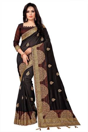 You Will Definitely Earn Lots Of Compliments Wearing This Rich And Elegant Looking Designer Saree In Dark Brown Color Paired With Brown Colored Blouse. This Saree Fabricated On Vichitra Silk Paired With Tafeta Art Silk Blouse. Buy This Pretty Saree Now.