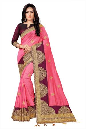 Look Attractive In This Pretty Embroidered Designer Saree In Pink Color Paired With Wine colored Blouse. This Saree Is Silk Based Paired With Tafeta Art Silk Fabricated Blouse. 