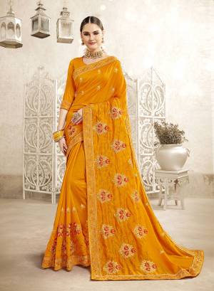 You Will Definitely Earn Lots Of Compliments Wearing This Designer Saree In Orange Color. This Saree And Blouse Are Silk Based Beautified With Attractive Embroidery. Buy This Pretty Piece Now.