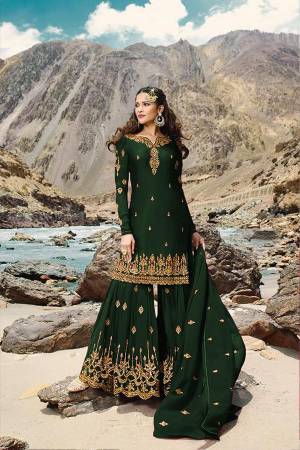 Grab This Very Pretty All Over Designer Sharara Suit In Dark Green Color. Its Lovely Top, Bottom And Dupatta Are Fabricated On Georgette Beautified With Jari Embroidery And Stone Work. Buy Now.
