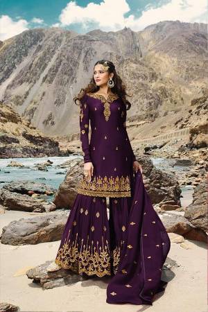 Grab This Very Pretty All Over Designer Sharara Suit In Dark Purple Color. Its Lovely Top, Bottom And Dupatta Are Fabricated On Georgette Beautified With Jari Embroidery And Stone Work. Buy Now.