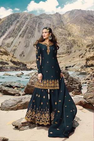 Grab This Very Pretty All Over Designer Sharara Suit In Teal Blue Color. Its Lovely Top, Bottom And Dupatta Are Fabricated On Georgette Beautified With Jari Embroidery And Stone Work. Buy Now.