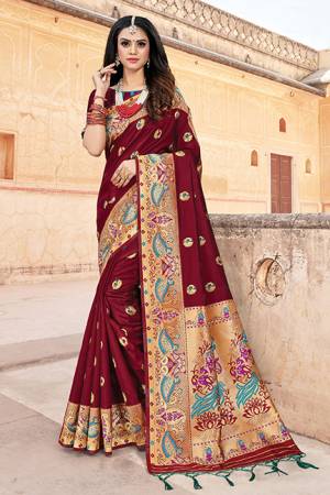 Here Is A Royal Looking Silk Based Designer Saree In Maroon Color. This Saree And Blouse Are Fabricated On Art Silk Beautified With Weave. Buy Now.