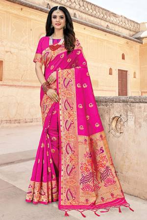 Here Is A Royal Looking Silk Based Designer Saree In Rani Pink Color. This Saree And Blouse Are Fabricated On Art Silk Beautified With Weave. Buy Now.