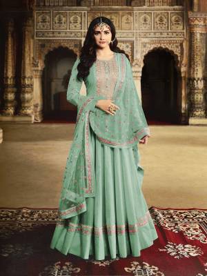 Get Ready For The Upcoming Wedding And Festive Season With This Heavy Designer Floor Length Suit In Sea Green Color. Its Embroidered Top Is Fabricated On Georgette Paired With Santoon Bottom And Net Fabricated Embroidered Dupatta. 