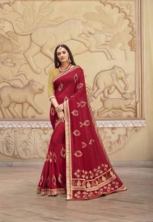 Celebrate This Festive With This Lovely Designer Saree In Red Color Paired With Contrasting Golden Colored Blouse. This Saree And Blouse Are Silk Beautified With Attractive Weaved Border And Embroidered Motifs. 