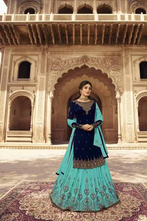 Grab This Very Beautiful Two In One Designer Lehenga Suit Which Comes With Two Bottoms. This Pretty Suit Is In Navy Blue Colored Top And Bottom Paired With Light Blue Colored Lehenga And Dupatta. Its Embroidered Top, Lehenga And Dupatta Are Fabricated On Georgette Paired With Santoon Fabricated Bottom. Buy Now.