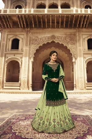 Grab This Very Beautiful Two In One Designer Lehenga Suit Which Comes With Two Bottoms. This Pretty Suit Is In Dark Green Colored Top And Bottom Paired With Light Green Colored Lehenga And Dupatta. Its Embroidered Top, Lehenga And Dupatta Are Fabricated On Georgette Paired With Santoon Fabricated Bottom. Buy Now.