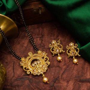 Grab This Heavy Double Chained Traditional Patterned Magalsutra Set Which Has A Heavy Designer Attatched Pendant With A Pair Of Earrings. This Mangalsutra Can Be Paired With Any Colored Traditional Attire And Suitable For Occasion Wear. Buy Now