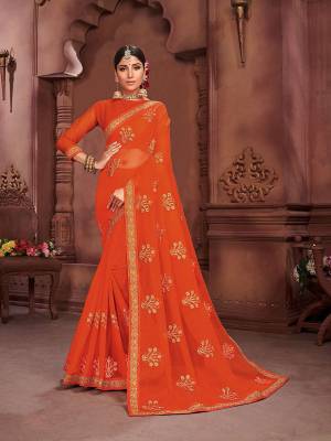 Look Attractive In This Pretty Designer saree In Orange Color. This Saree Is Fabricated On Chiffon Beautified Elegant Embroidery Giving An Attractive Look. Buy Now.