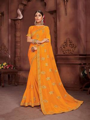 Add This Beautiful Saree To your Wardrobe In Musturd Yellow Color. This Pretty Saree Is Chiffon Based Beautified With Embrioidered Motifs. It Is Light In Weight And Easy To Carry All Day Long. 