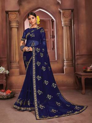 This Festive Season Look The Most Prettiest Of All Wearing This Designer Saree in Navy Blue Color. This Saree Is Fabricated On Chiffon Beautified With Elegant Embroidery. 