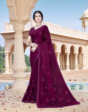 Here Is A Rich And Elegant Looking Designer Saree In Wine Color Paired With Wine Colored Blouse. This Saree Is Chinon Based Paired With Art Silk Fabricated Blouse. It Is Beautified With Tone To Tone Embroidery. 
