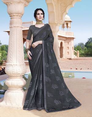 You Will Definitely Earn Lots of Compliments Wearing This Designer Tone To Tone Embroidered Saree In Dark Grey Color. This Pretty Saree Is Fabricated On Chinon Paired With Art Silk Fabricated Blouse. Buy Now.