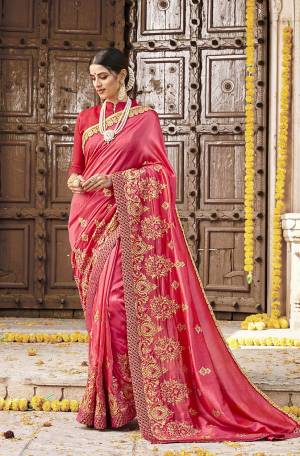 Attract All Wearing This Designer Saree In Old Rose Pink Color. This Saree Is Fabricated On Satin Silk Paired With Art Silk Fabricated Blouse. Its Bright Color And Attractive Embroidery will Give You A Look Like Never Before. 