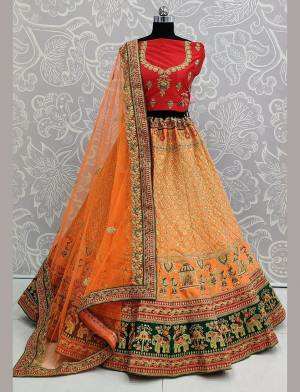 Here Is A Heavy Designer Lehenga Choli In A Proper Traditional Look With Traditional Color Combination In Red Colored Blouse Paired With Orange Colored Heavy Embroidered Lehenga And Orange Colored Dupatta. This Pretty Blouse And Lehenga Are Satin Based Paired With Net Fabricated Dupatta. 
