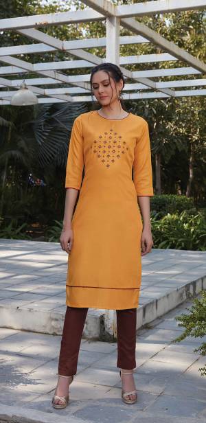 For Youe Semi-Casual Wear, Grab This Readymade Pair Of Kurti With Bottom Which Is Cotton Based. The Pretty Kurti Is In Musturd Yellow Color Paired With Brown Colored Bottom. 