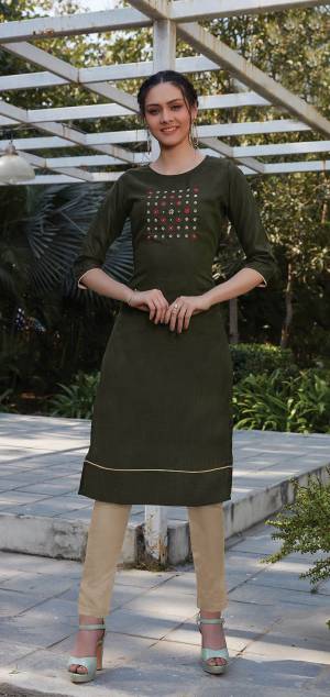 For Youe Semi-Casual Wear, Grab This Readymade Pair Of Kurti With Bottom Which Is Cotton Based. The Pretty Kurti Is In Dark Olive Green Color Paired With Cream Colored Bottom. 