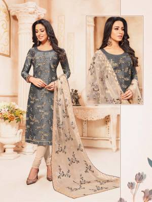 Flaunt Your Rich And Elegant Taste Wearing This Designer Straight Suit In Rich Color Pallete Of Grey And Cream. Its Top Is Fabricated On Modal Silk Paired With Cotton Bottom And Oregnza Fabricated Dupatta. 