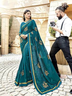 Shine Bright Wearing This Lovely Designer Saree In Blue Color Paired With Blue Colored Blouse. This Pretty Saree Is Silk Georgette Based Paired With Art Silk Fabricated Blouse. It Is Beautified With Detailed Attractive Embroidery. Buy Now.