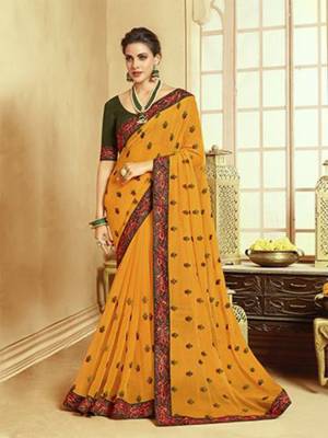 Catch All The Limelight At The Next Function You Attend Wearing This Pretty Designer Saree In Musturd Yellow Color. This Lovely Saree Is Fabricated On Georgette Paired With Art Silk Fabricated Blouse. It Is Beautified With Multi Colored Thread Work Givng An Attractive Look. Buy Now.