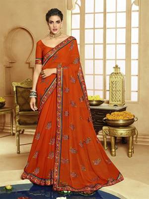 Catch All The Limelight At The Next Function You Attend Wearing This Pretty Designer Saree In Orange Color. This Lovely Saree Is Fabricated On Georgette Paired With Art Silk Fabricated Blouse. It Is Beautified With Multi Colored Thread Work Givng An Attractive Look. Buy Now.