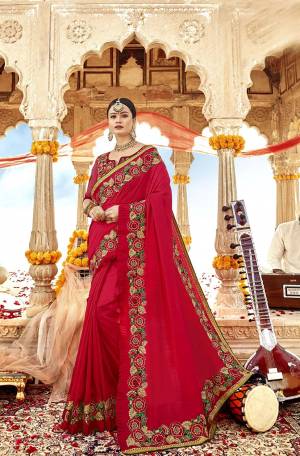 Adorn The Pretty Angelic Look In This Lovely Heavy Designer Red Colored Saree. This Saree And Blouse Are Silk Based Beautified With Attractive Detailed Embroidery. 