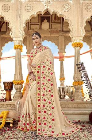 Flaunt Your Rich And Elegant Taste Wearing This Cream Colored Designer Saree. This Saree And Blouse Are Silk Based Which Also Gives A Rich Look To Your Personality. 