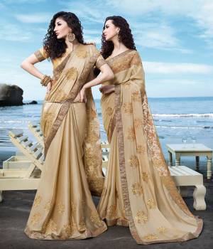 Here Is A Rich And Elegant Looking Designer Saree In Beige Color Paired With Beige Colored Blouse. This Saree Is Satin Georgette Based Paired With Art Silk Fabricated Blouse. It Is Beautified With Tone To Tone Embroidery