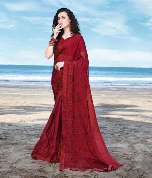 You Will Definitely Earn Lots of Compliments Wearing This Designer?Tone To Tone Embroidered Saree In MaroonColor. This Pretty Saree Is Fabricated On Satin Georgette Paired With Art Silk Fabricated Blouse. Buy Now.