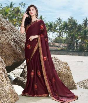 Enhance Your Personality Wearing This Designer Saree In Dark Maroon Color. This Pretty Tone To Tone Embroidered Saree Is Fabricated On Satin Georgette Paired With Art Silk Fabricated Blouse. Also It Is Light Weight And easy To Drape.?