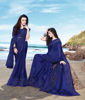 You Will Definitely Earn Lots of Compliments Wearing This Designer?Tone To Tone Embroidered Saree In Royal Blue Color. This Pretty Saree Is Fabricated On Satin Georgette Paired With Art Silk Fabricated Blouse. Buy Now