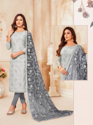 Flaunt Your Rich Taste Wearing This Heavy Dupatta Embroidered Suit In Light Grey Colored Top Paired With Grey Colored Bottom And Dupatta. Its Top Is Fabricated On Modal Silk Paired With Cotton Bottom And Net Fabricated Dupatta. Buy This Pretty Suit Now.