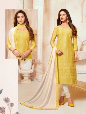 You Will Definitely Earn Lots Of Compliments Wearing This Designer Straight Suit In Musturd Yellow Color Paired With Off-White Colored Bottom And Dupatta. Its Detailed Embroidered Top Is Fabricated On Modal Silk Paired With Cotton Bottom And Chiffon Fabricated Dupatta. 
