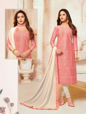 You Will Definitely Earn Lots Of Compliments Wearing This Designer Straight Suit In Pink Color Paired With Off-White Colored Bottom And Dupatta. Its Detailed Embroidered Top Is Fabricated On Modal Silk Paired With Cotton Bottom And Chiffon Fabricated Dupatta. 