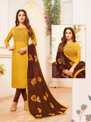 Add This Designer Straight Suit To Your Wardrobe In Musturd Yellow Colored Top Paired With Contrasting Brown Colored Bottom And Dupatta. Its Top and Bottom are Cotton Based Paired With Chiffon Fabricated Dupatta. 
