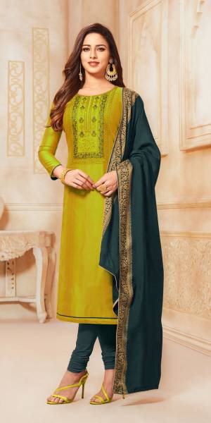 For Your Semi-Casual Wear, Grab This Lovely Straight Suit In Parrot Green Color Paired With Dark Grey Colored Bottom And Dupatta. Its Top Is Fabricated On South Cotton Paired With Cotton Bottom And Jacquard Silk Fabricated Dupatta. Buy Now.