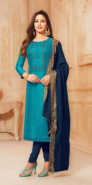 For Your Semi-Casual Wear, Grab This Lovely Straight Suit In Blue Color Paired With Navy Blue Colored Bottom And Dupatta. Its Top Is Fabricated On South Cotton Paired With Cotton Bottom And Jacquard Silk Fabricated Dupatta. Buy Now.