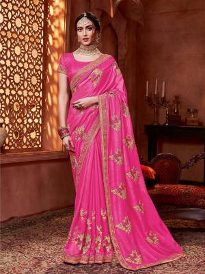 Get Ready For The Upcoming Wedding And Festive Season With This Designer Saree In Pink Color. This Tone To Tone Embroidered Saree Is Fabricated On Vichitra Silk Paired With Art Silk Fabricated Blouse.