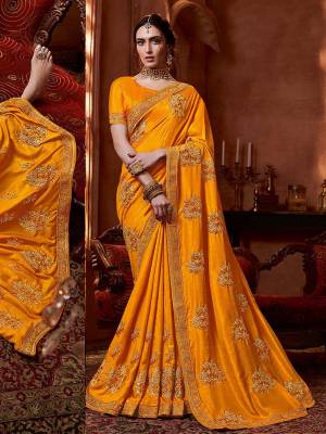 Get Ready For The Upcoming Wedding And Festive Season With This Designer Saree In Musturd Yellow Color. This Tone To Tone Embroidered Saree Is Fabricated On Vichitra Silk Paired With Art Silk Fabricated Blouse.