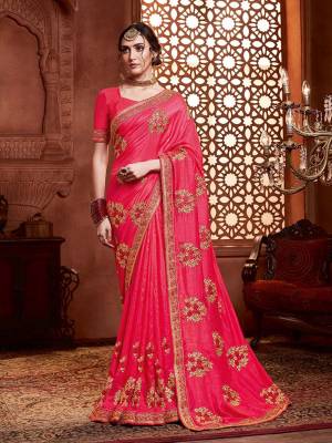 Get Ready For The Upcoming Wedding And Festive Season With This Designer Saree In Rani Pink Color. This Tone To Tone Embroidered Saree Is Fabricated On Vichitra Silk Paired With Art Silk Fabricated Blouse.