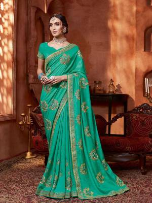 Get Ready For The Upcoming Wedding And Festive Season With This Designer Saree In Turquoise Blue Color. This Tone To Tone Embroidered Saree Is Fabricated On Vichitra Silk Paired With Art Silk Fabricated Blouse.