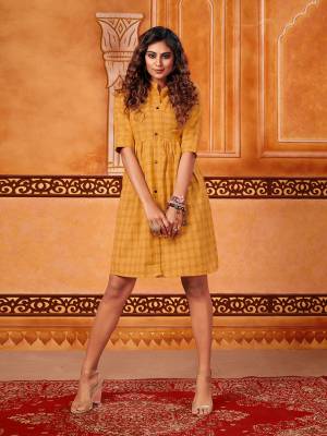 Here Is A Trendy Tunic Pattern Readymade Kurti In Musturd Yellow Color. This Kurti Is Fabricated On Cotton Beautified With Checks Prints All Over. It Is Light Weight And Its Fabric Ensures Superb Comfort All Day Long. 