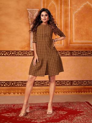 Here Is A Trendy Tunic Pattern Readymade Kurti In Brown Color. This Kurti Is Fabricated On Cotton Beautified With Checks Prints All Over. It Is Light Weight And Its Fabric Ensures Superb Comfort All Day Long. 